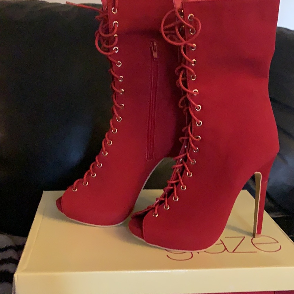 New in the box. Never worn red peep toe boot